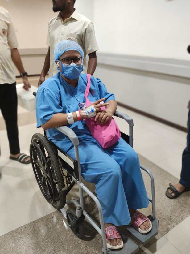 Post surgery in a wheelchair and with drain pipe attached